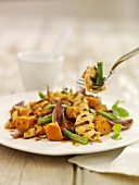Grilled chicken pieces with green beans and sweet potato