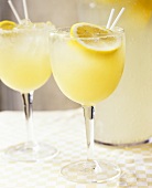 Home-made lemonade in stemmed glasses