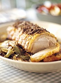 Roast pork roll with roasted fennel