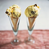 Vanilla ice cream with pieces of bread pudding in cones 