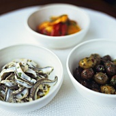Assorted antipasti in small bowls