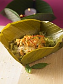 Chicken with coconut in banana leaf (Thailand)