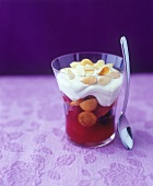 Fruit sundae with cream topping and flaked almonds