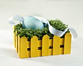 Easter egg in a nest of cress