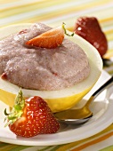 Strawberry semolina pudding in hollowed-out melon