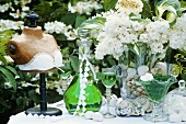 May-time decoration: woodruff liqueur, bust, lilac