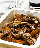 Oven-baked lamb chops with potatoes in baking dish