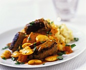Sausages with white beans and mashed potato