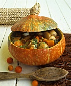 Hearty pumpkin stew in hollowed-out pumpkin