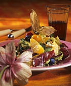 Mixed salad leaves with fruit and ham