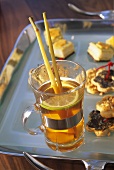 Exotic green tea punch, cheese biscuits & crackers on tray