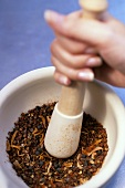Crushing spices in a mortar