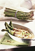 Green asparagus with ham and cheese gratin topping