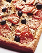 Pizza with tomatoes, olives and artichokes