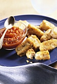 Fish fingers with orange and tomato dip