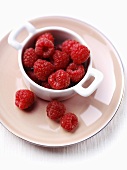 Fresh raspberries in a small bowl