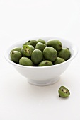 Baby kiwi fruits in a small bowl