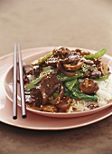 Beef with mushrooms on rice