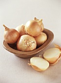 Several onions in a bowl