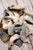 Fresh shrimp tails on wooden background