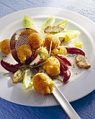 Deep-fried Camembert balls with salad and guinea fowl