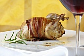 Quail wrapped in bacon