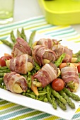 Potatoes and bacon-wrapped figs with vegetables