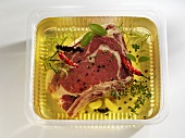 A slice of beef forerib in herb marinade