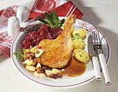 Goose leg with red cabbage, apples and raisins