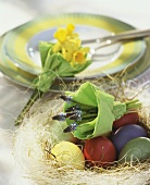 Easter nest with coloured eggs & posies