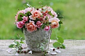 Arrangement of roses with wild strawberries