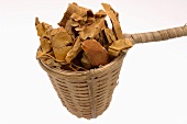Dried snake gourd peel in a small basket
