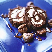 Chocolate roulade with cream filling & chocolate sauce