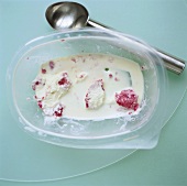 Remains of ice cream in plastic tub