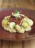 Fried halibut fillet on risotto with mushrooms & chestnuts