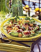 Salad leaves with fruit and bacon
