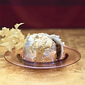 Small Christmas cake decorated with gold and silver leaf