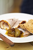 Green tomato chutney served with cold roast pork and bread