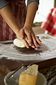 Kneading pizza dough