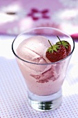 Strawberry ice cream in a glass with fresh strawberry