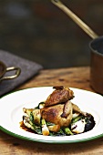 Smoked quail with pak choi and spring onions