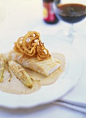 Cod with fried onions, beer sauce and chicory