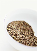 Green lentils in a glass bowl