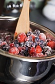 Berry jam, mixing in the sugar
