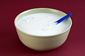 Kefir in a bowl with spoon