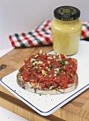 Steak tartare with anchovies & capers on a slice of bread