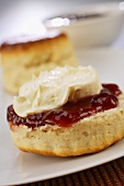 Scone with jam and clotted cream (England)