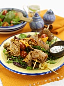 Turkey kebabs on salad leaves