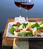 Salad leaves with goat's cheese & pomegranate vinaigrette
