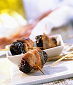 Canapés: bacon-wrapped prunes